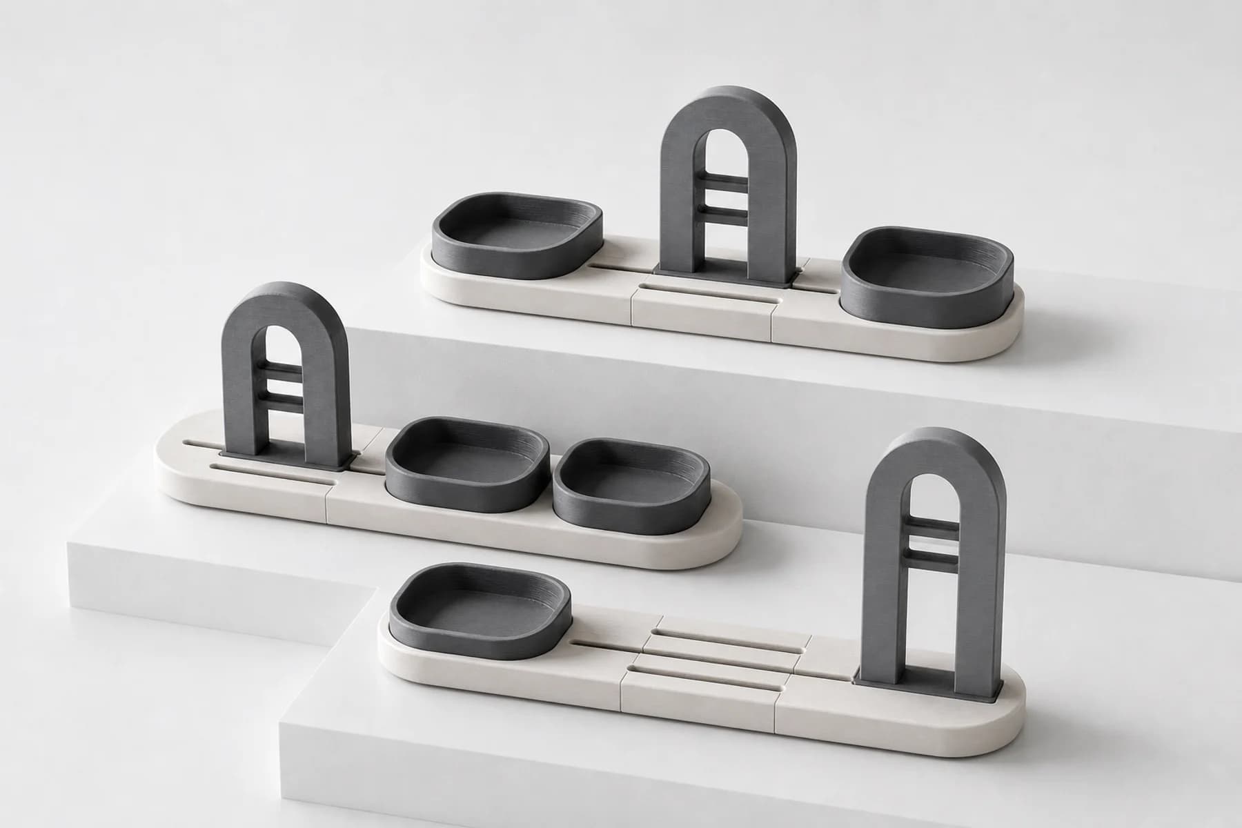 Three finished configurations of the Matter Form organizer displayed on white plinths.