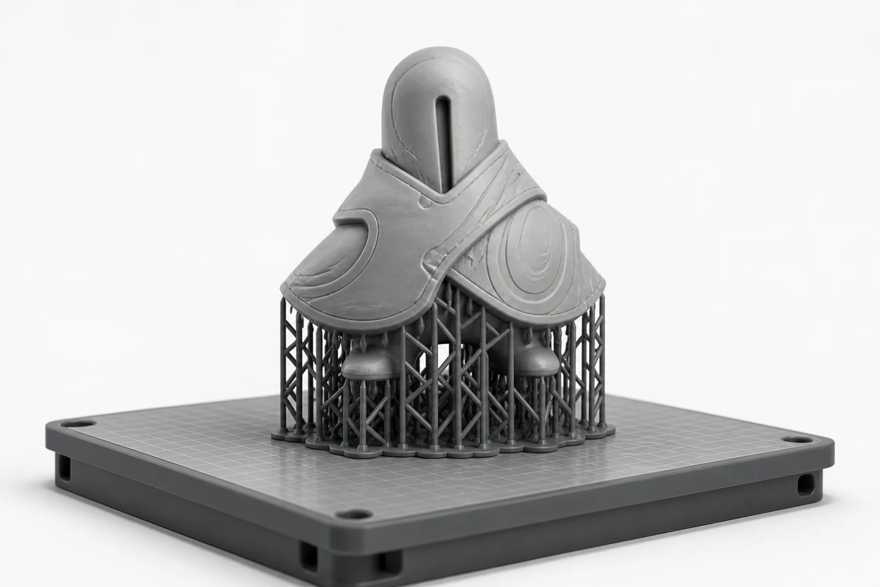 The Small Gods model prepared on a resin build plate with a structured support lattice.